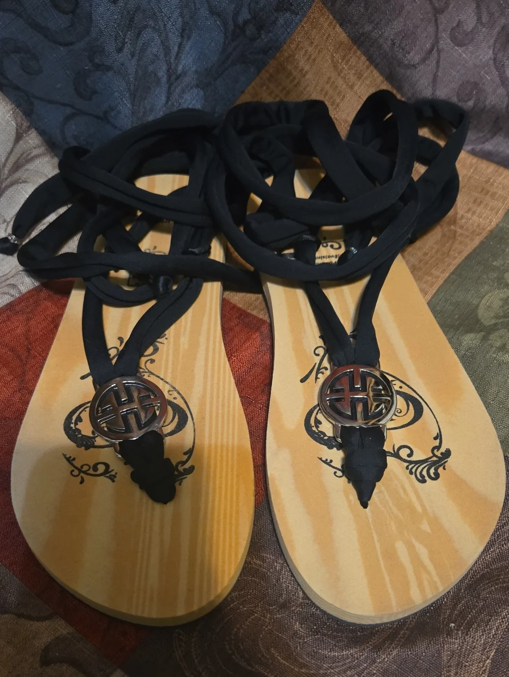 Black Lace-Up Thong Sandals with Decorative Medallion